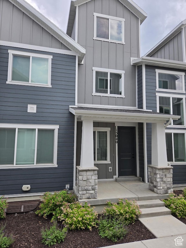 15040 S Wild Horse Way, Bluffdale, UT 84065 - modern home featuring board and batten siding, a porch, and stone siding