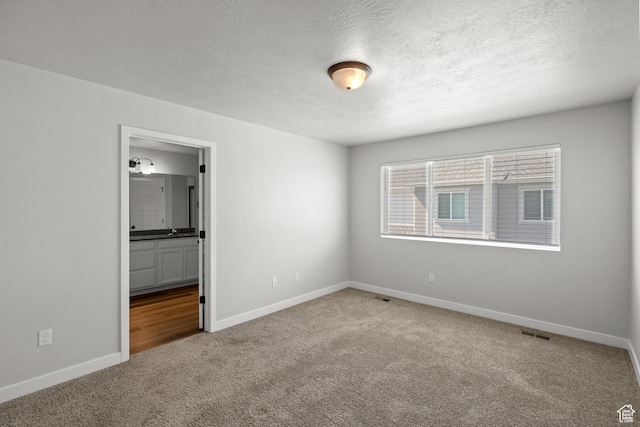 15040 S Wild Horse Way, Bluffdale, UT 84065 - carpeted empty room with a textured ceiling
