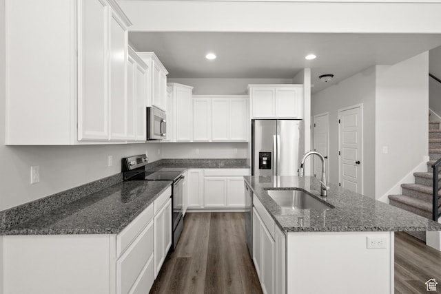 15040 S Wild Horse Way, Bluffdale, UT 84065 - kitchen with appliances with stainless steel finishes, an island with sink, white cabinetry, and recessed lighting