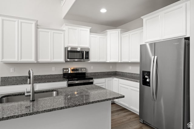 15040 S Wild Horse Way, Bluffdale, UT 84065 - kitchen featuring stainless steel appliances, white cabinetry, dark stone counters, and recessed lighting