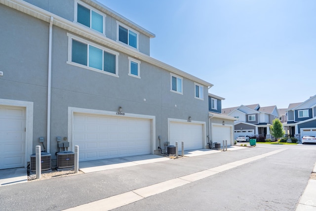 15040 S Wild Horse Way, Bluffdale, UT 84065 - back of property with stucco siding, a residential view, and a garage