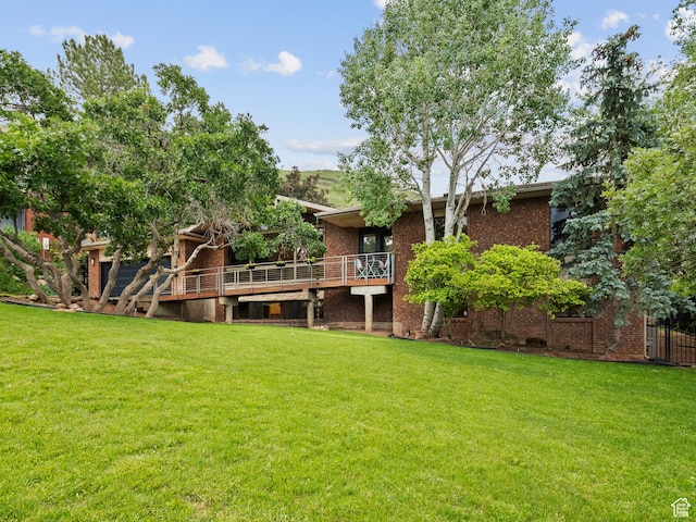 2842 E Oakbrook Cir, Salt Lake City, UT 84108 - view of grassy yard featuring a wooden deck