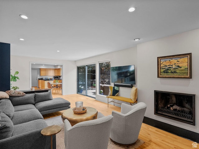 2842 E Oakbrook Cir, Salt Lake City, UT 84108 - living area with wood finished floors, recessed lighting, and a fireplace