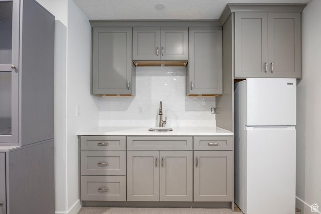 1681 S 1110 E, Heber City, UT 84032 - kitchen with freestanding refrigerator, gray cabinets, light countertops, and backsplash