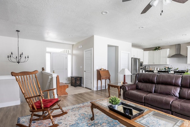 1681 S 1110 E, Heber City, UT 84032 - living room featuring wood finished floors, a textured ceiling, ceiling fan, and a chandelier