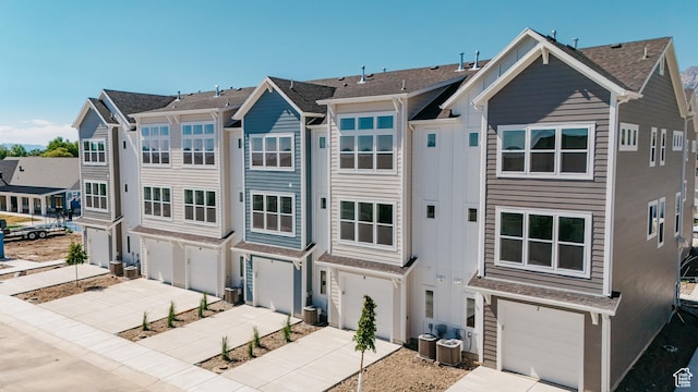 247 E 1825 N Unit 5, North Ogden, UT 84414 - view of front of house with an attached garage, driveway, and a shingled roof