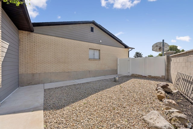 2104 W Champagne Cir, Taylorsville, UT 84129 - view of side of home with brick siding