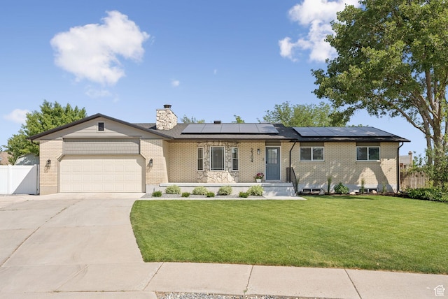 2104 W Champagne Cir, Taylorsville, UT 84129 - ranch-style house with an attached garage, concrete driveway, solar panels, and brick siding