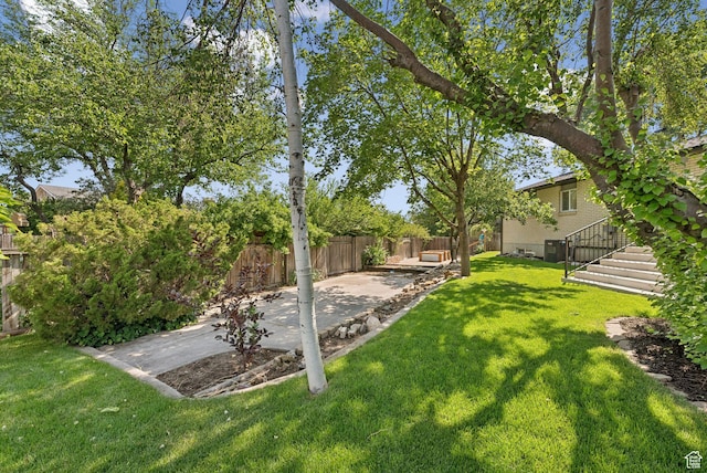 2104 W Champagne Cir, Taylorsville, UT 84129 - fenced backyard with a patio area and stairway