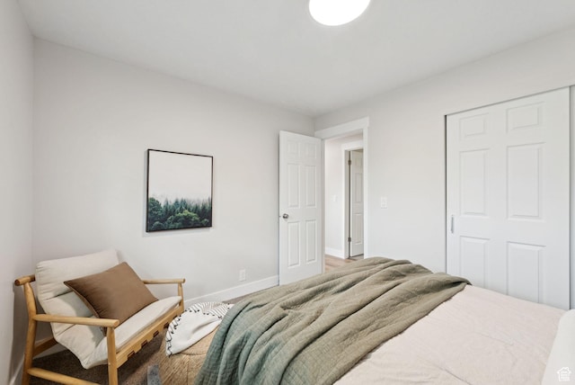 2104 W Champagne Cir, Taylorsville, UT 84129 - bedroom featuring baseboards and a closet
