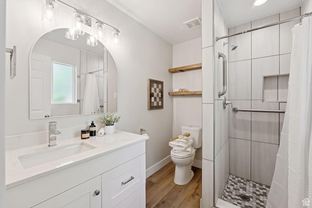 2104 W Champagne Cir, Taylorsville, UT 84129 - bathroom with vanity, a shower stall, and wood finished floors