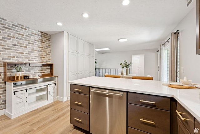 2104 W Champagne Cir, Taylorsville, UT 84129 - kitchen with dishwasher, light wood-style flooring, dark brown cabinetry, light countertops, and recessed lighting