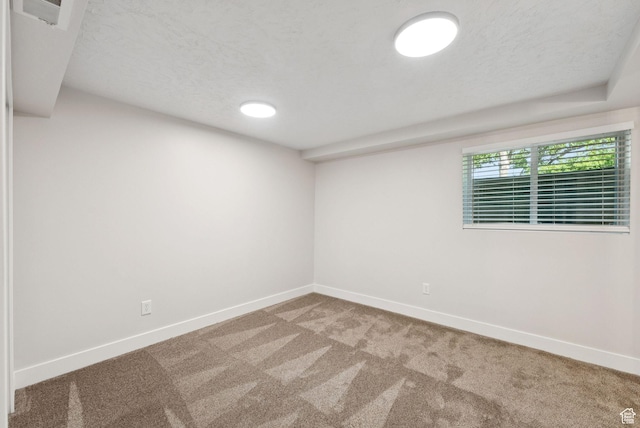 2104 W Champagne Cir, Taylorsville, UT 84129 - carpeted empty room with baseboards and a textured ceiling