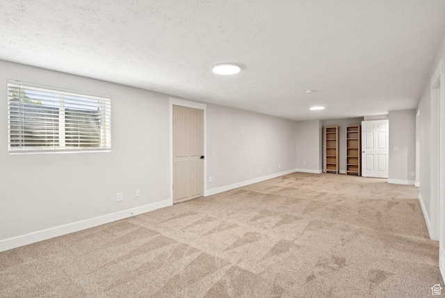 2104 W Champagne Cir, Taylorsville, UT 84129 - below grade area with light colored carpet and a textured ceiling