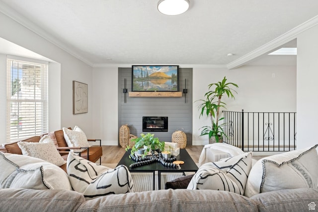 2104 W Champagne Cir, Taylorsville, UT 84129 - living area with wood finished floors, a large fireplace, and crown molding