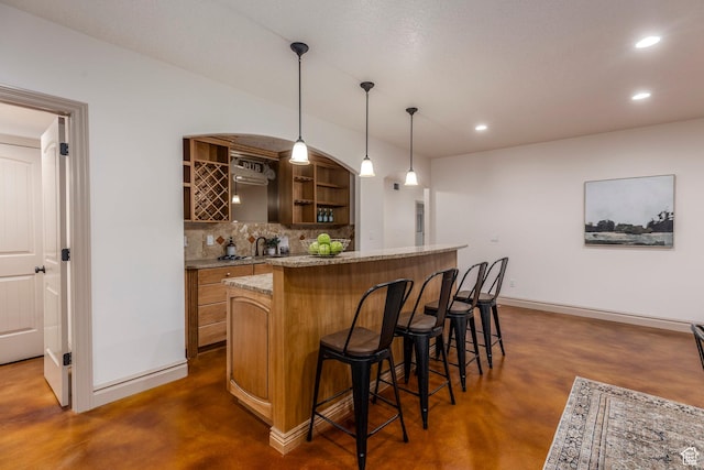 10677 S Amberley Ln E, Sandy, UT 84094 - indoor wet bar with concrete flooring, decorative backsplash, recessed lighting, and hanging light fixtures