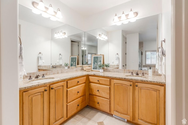 10677 S Amberley Ln E, Sandy, UT 84094 - full bath with double vanity, tile patterned floors, and backsplash