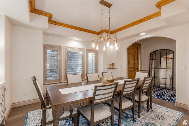 10677 S Amberley Ln E, Sandy, UT 84094 - dining space featuring wood finished floors, arched walkways, a raised ceiling, and recessed lighting