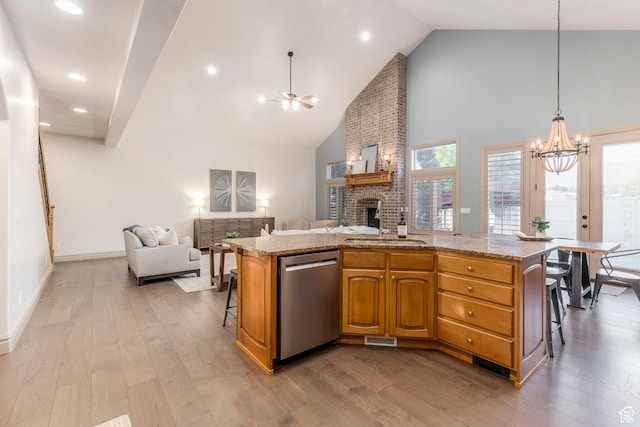 10677 S Amberley Ln E, Sandy, UT 84094 - kitchen with stainless steel dishwasher, open floor plan, a chandelier, dark wood finished floors, and high vaulted ceiling