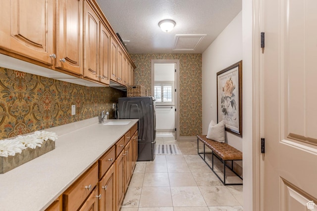 10677 S Amberley Ln E, Sandy, UT 84094 - laundry room featuring cabinet space, a textured ceiling, light tile patterned flooring, and washing machine and dryer