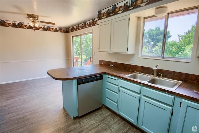 1063 W 1100 N, Provo, UT 84604 - kitchen with dishwasher, dark countertops, a peninsula, dark wood-type flooring, and white cabinetry