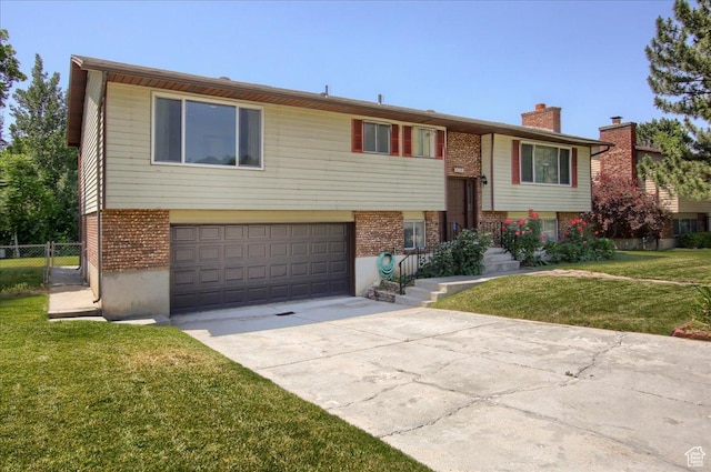 1063 W 1100 N, Provo, UT 84604 - bi-level home featuring brick siding, an attached garage, concrete driveway, and a chimney
