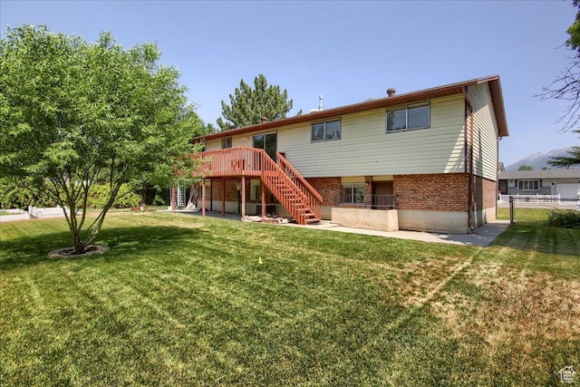 1063 W 1100 N, Provo, UT 84604 - back of property featuring stairway, a wooden deck, and brick siding