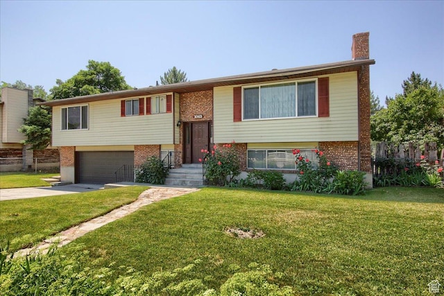 1063 W 1100 N, Provo, UT 84604 - bi-level home with brick siding, driveway, a garage, and a chimney