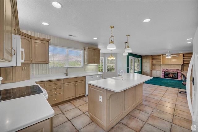 1912 W Rivers Edge Ln, St George, UT 84770 - kitchen featuring white appliances, a ceiling fan, light countertops, a kitchen island with sink, and open floor plan