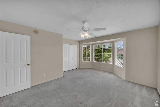 1912 W Rivers Edge Ln, St George, UT 84770 - unfurnished bedroom featuring carpet flooring, a closet, ceiling fan, and a textured ceiling