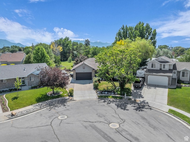 2352 N 1160 W, Clinton, UT 84015 - view of front of home featuring concrete driveway, a front yard, a mountain view, and a residential view