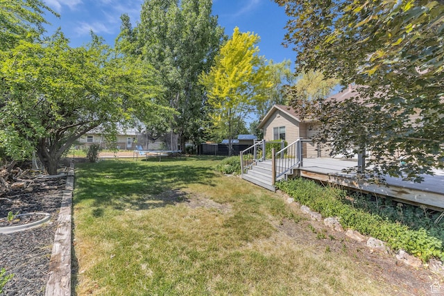 2352 N 1160 W, Clinton, UT 84015 - view of yard with a trampoline and a deck