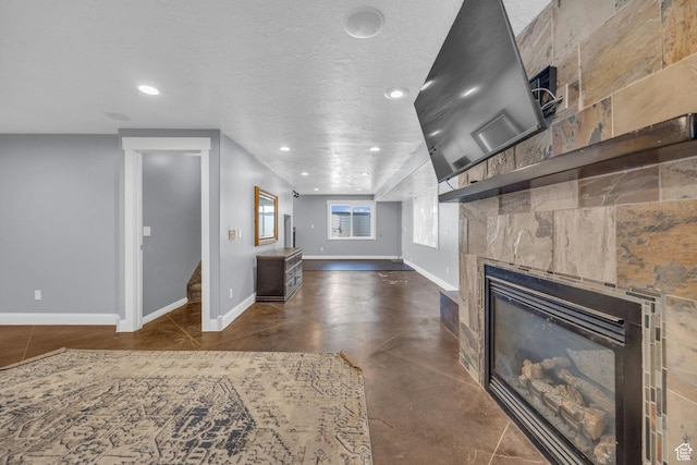 2352 N 1160 W, Clinton, UT 84015 - unfurnished living room with a tiled fireplace, recessed lighting, stairway, and finished concrete floors