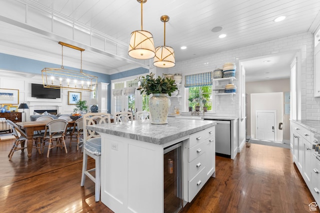 1254 W 475 S, Farmington, UT 84025 - kitchen with beverage cooler, stainless steel dishwasher, a center island, white cabinetry, and a breakfast bar area