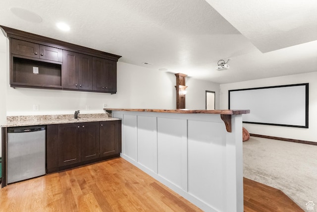 1254 W 475 S, Farmington, UT 84025 - kitchen with dishwasher, dark brown cabinetry, a peninsula, and light stone counters