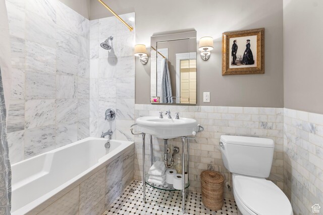 1254 W 475 S, Farmington, UT 84025 - full bath featuring tile walls, tiled shower / bath combo, a wainscoted wall, and tile patterned floors