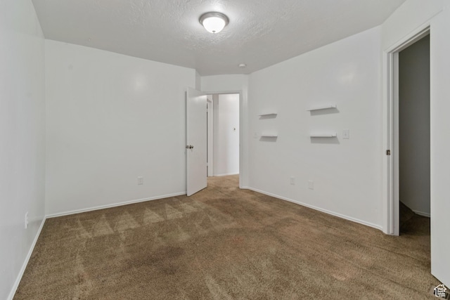 814 E Meadow Pine Ct, Salt Lake City, UT 84106 - empty room featuring carpet floors and a textured ceiling