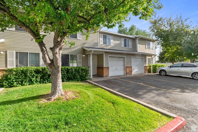 814 E Meadow Pine Ct, Salt Lake City, UT 84106 - multi unit property featuring asphalt driveway, an attached garage, brick siding, and a front yard