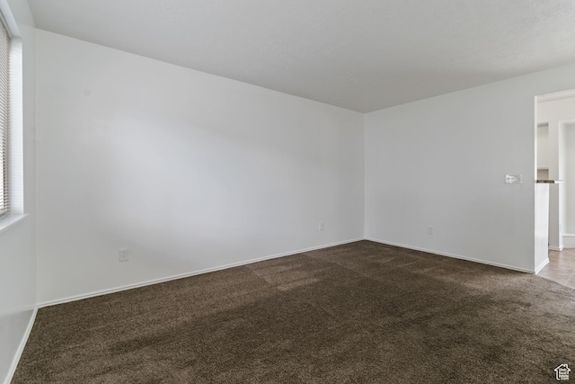 814 E Meadow Pine Ct, Salt Lake City, UT 84106 - spare room with dark carpet and baseboards