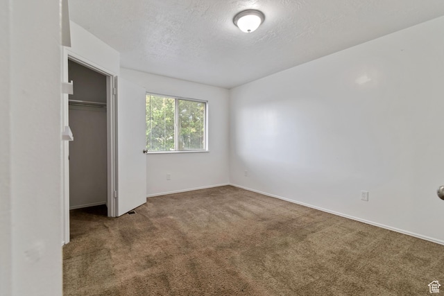 814 E Meadow Pine Ct, Salt Lake City, UT 84106 - unfurnished bedroom with carpet flooring, a textured ceiling, and a closet