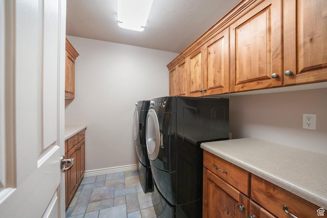 3116 W Hayden Ridge Way, Riverton, UT 84065 - laundry area featuring cabinet space, washing machine and dryer, and light stone finish floors