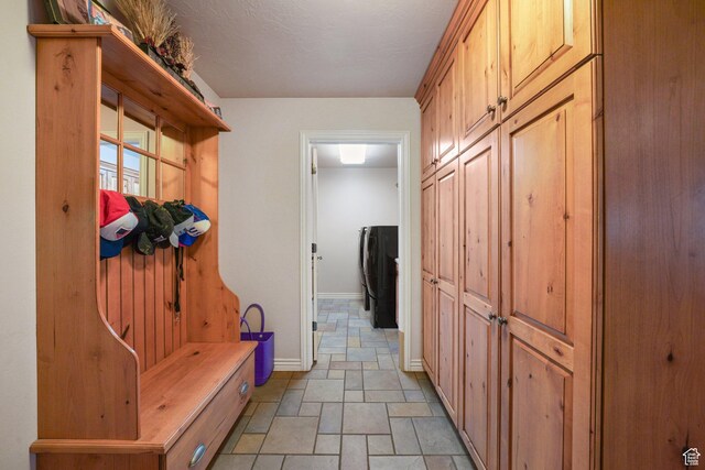 3116 W Hayden Ridge Way, Riverton, UT 84065 - mudroom featuring baseboards and stone finish flooring