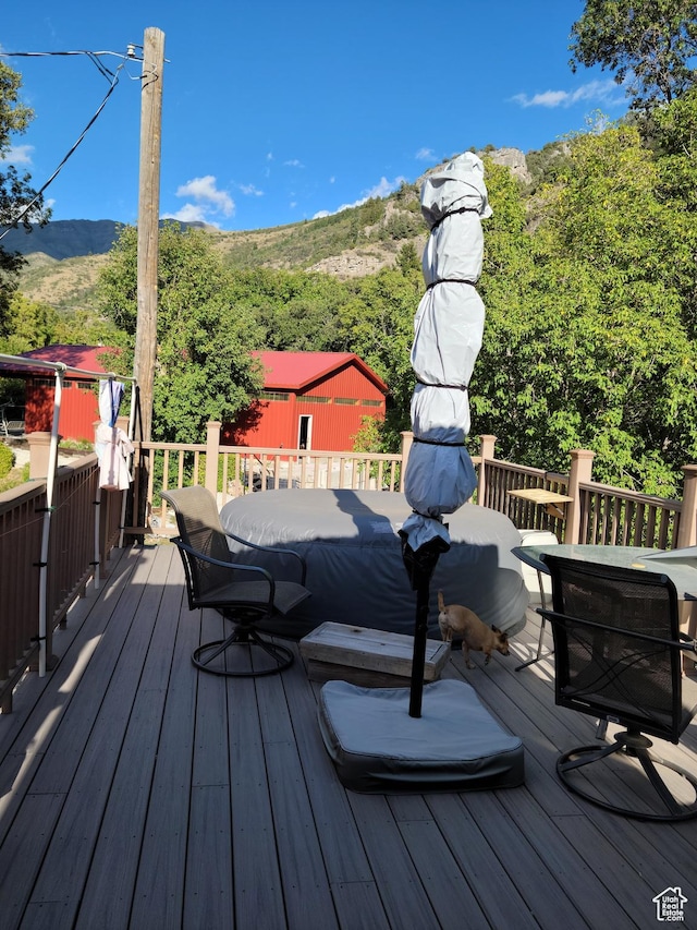 97 Main St, Ophir, UT 84071 - wooden deck featuring a mountain view and outdoor dining area