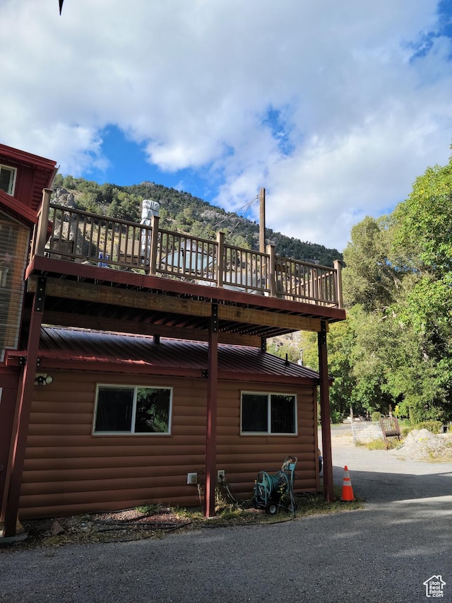 97 Main St, Ophir, UT 84071 - view of side of home featuring faux log siding and a wooden deck