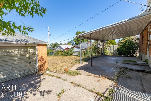 3317 Jackson Ave, Ogden, UT 84403 - view of patio with an outdoor structure and a carport