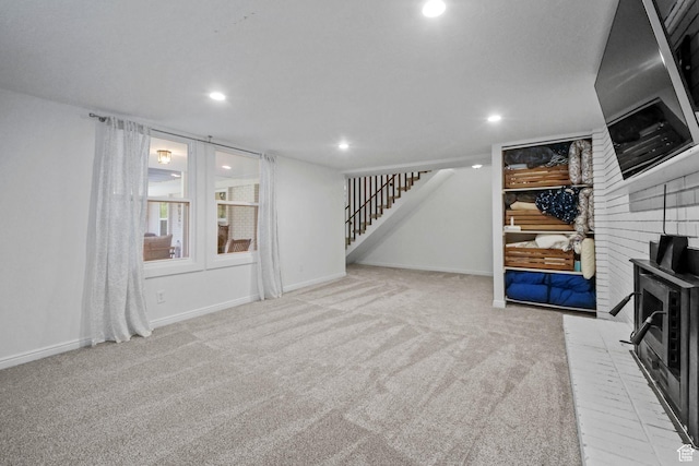 578 S 750 E, Bountiful, UT 84010 - unfurnished living room with carpet flooring, stairs, recessed lighting, and a wood stove