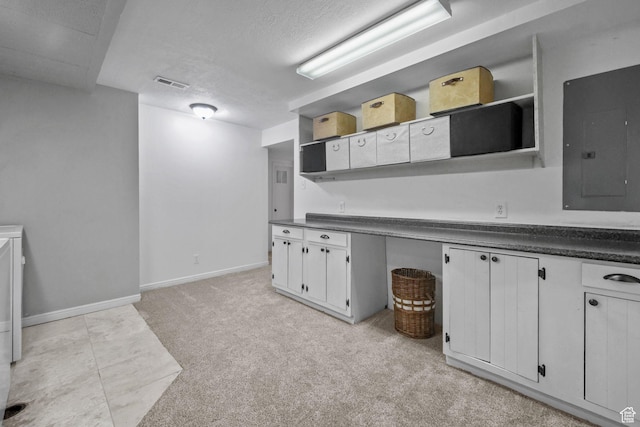 578 S 750 E, Bountiful, UT 84010 - kitchen with open shelves, electric panel, dark countertops, light carpet, and a textured ceiling