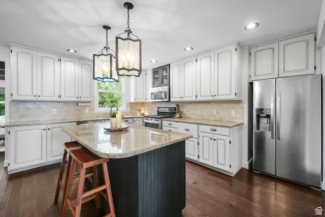 578 S 750 E, Bountiful, UT 84010 - kitchen featuring appliances with stainless steel finishes, dark wood finished floors, white cabinets, and recessed lighting