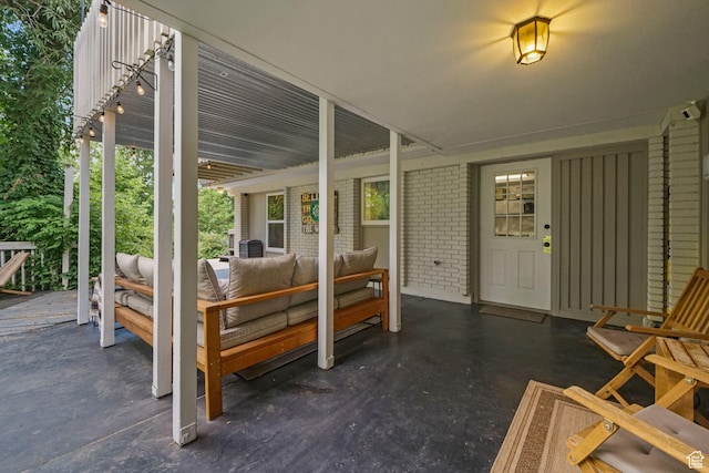 578 S 750 E, Bountiful, UT 84010 - property entrance featuring an outdoor living space, brick siding, and a patio area