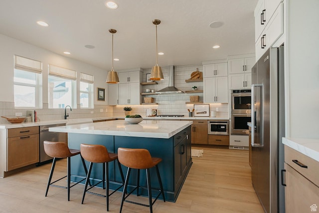 3488 E 1120 S Unit 115, Spanish Fork, UT 84660 - kitchen with appliances with stainless steel finishes, open shelves, tasteful backsplash, a kitchen breakfast bar, and a kitchen island
